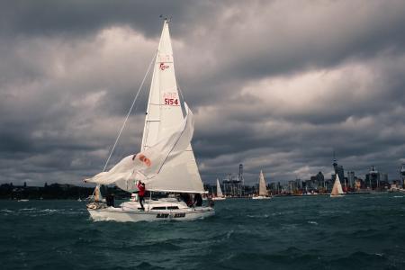 An image of a sailboat on the water on a stormy day